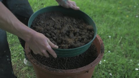 Sieving soil to re any rocks and roots