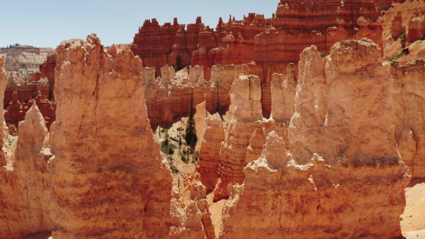 Cinematic aerial of Bryce Canyon National Park, red rocky spires, natural phenomena, landscape of another planet, scenic Utah