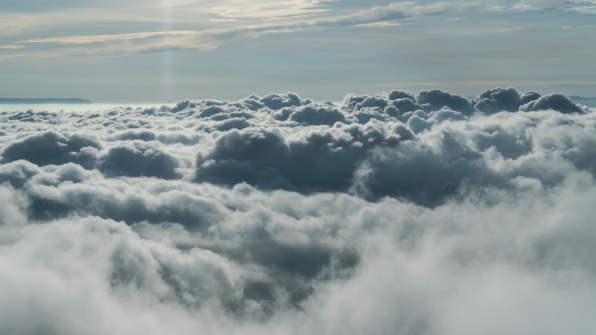 Footage B-roll timelapse foggy or over the clouds while sunrise sky. A sea of fog is formed from stratus. Foggy valley mount ridge nature. Time lapse Beautiful foggy and cloudy slow moving Aerial view Royalty-Free Stock Footage #1055137544