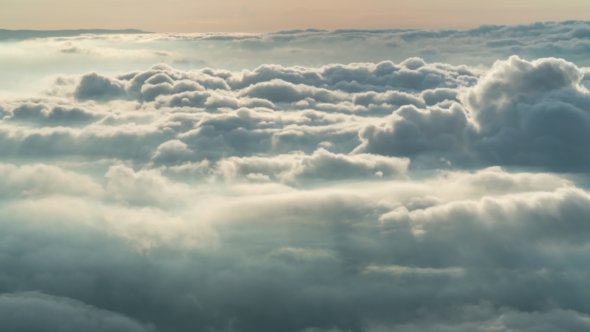Footage B-roll timelapse foggy or over the clouds while sunrise sky. A sea of fog is formed from stratus. Foggy valley mount ridge nature. Time lapse Beautiful foggy and cloudy slow moving Aerial view Royalty-Free Stock Footage #1055138714