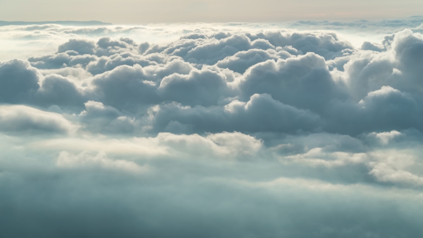 Footage B-roll timelapse foggy or over the clouds while sunrise sky. A sea of fog is formed from stratus. Foggy valley mount ridge nature. Time lapse Beautiful foggy and cloudy slow moving Aerial view