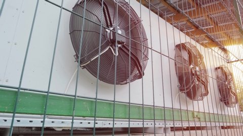 Metal industrial air conditioning vent. HVAC. Commercial cooling HVAC air conditioner condenser fan units battery set climate control and refrigeration temperature AC conditioning system