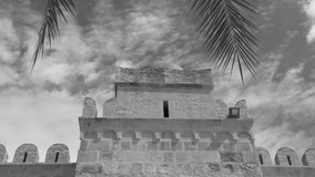 Black and white video timelapse of old walls of ancient building in Tunisia. Sousse city.