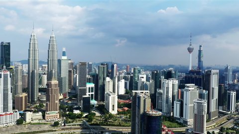 Aerial Cinematic Kuala Lumpur City With Petronas Twin Tower View And Beautiful Summer Sky 4K Drone Footage