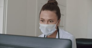 doctor face looking at office monitor . Close-up of woman thinking about results, patients, work. Portrait of female looking laptop at home. Over display camera shot. 4k raw video footage slow motion
