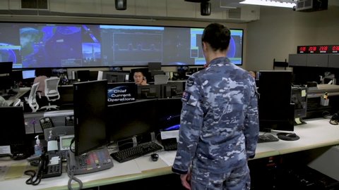 CIRCA 2020 - Establishing shot of personnel in the Combined Space Operations Center at Vandenberg AFB, California.