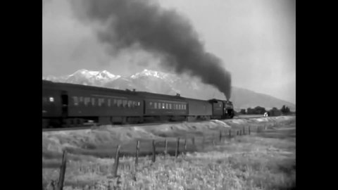 CIRCA 1938 - Passengers ride the Denver & Rio Grande Western Railroad from Ogden to Salt Lake City, Utah.