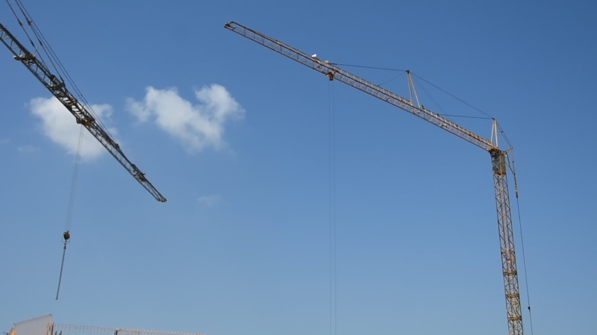 Scene of crane at building construction site, architecture apartments backgrounds with engineering.