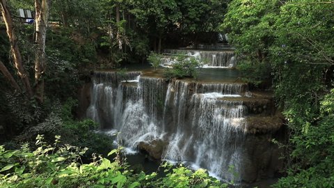 beautiful deep forest waterfall pour downward rapidly to each step, Huay Mae Kamin waterfall in Thailand