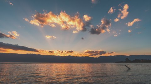 4K, 10BIT, YUV422  timelapse video of Erhai Lake in sunset with moving clouds, lake sunset, Dali, Yunnan, China