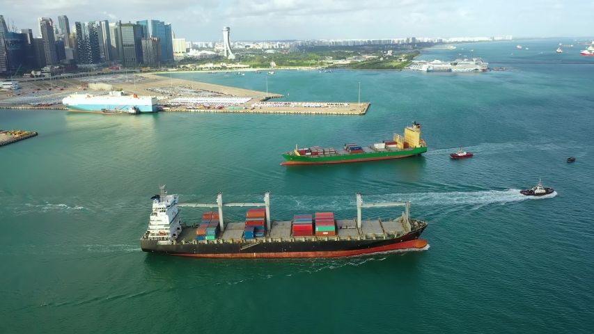 Drone Aerial view 4k Footage of International Containers Cargos ship,Freight Transportation, Shipping,Trade Port,Shipping cargo to harbor, Nautical Vessel.Logistics import export Container Cargo ship Royalty-Free Stock Footage #1055208245