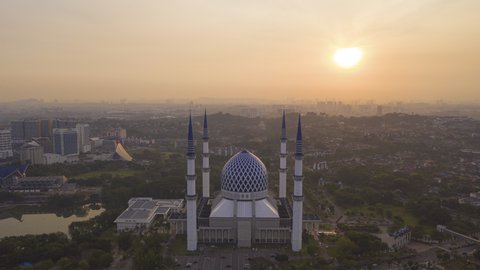 SHAH ALAM, MALAYSIA - MARCH 01, 2020 :  Shah Alam Aerial revealing time lapse view of Sultan Salahuddin Abdul Aziz Shah Mosque in Selangor, Malaysia at sunrise. Prores UHD