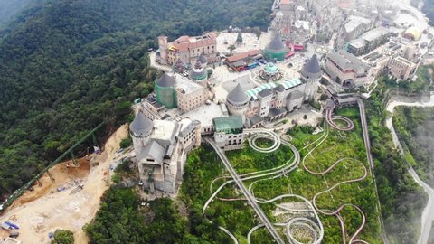 High quality royalty free stock footage, Aerial view of landscape of the castles at the top of Bana Hills, the famous tourist destination of Da Nang, Vietnam. Near Golden bridge. 