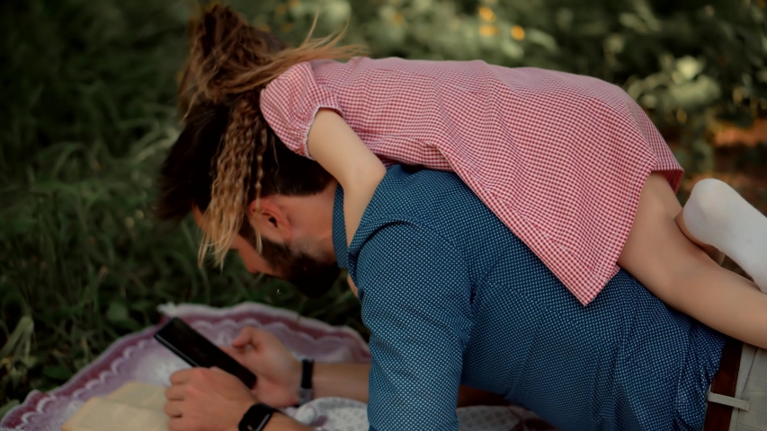 Daddy Watching Fairy Tale Story On Mobile Phone Screen. Daughter Sitting On Father Back And Looking Cartoon.Single Parent Dad Teach Adorable Cute Preschool Child Girl.Cheerful Children Education Learn