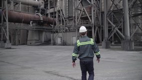 Engineer Walking and Working Around the Factory near Docks Slow Motion High Quality Industrial Video