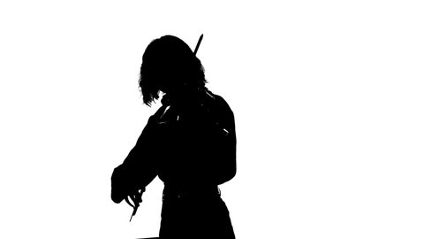 black silhouette on a white background, closeup of pretty girl violinist playing the classical violin in front of the spotlight