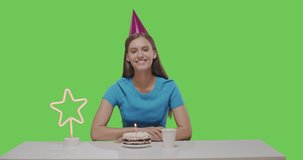 Woman eating piece of cake, alone birthday celebration. Girl having fun on green screen background, chroma key . Happy female looking at camera talking make video chat, conference call, webcam view.