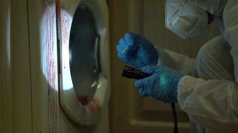 CSI Taking Blood Sample At Murder Scene In Kitchen, Crime Scene Investigation.