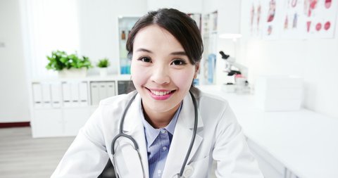 Telemedicine concept - asian female doctor listening to patient talking symptom on the internet and video chat