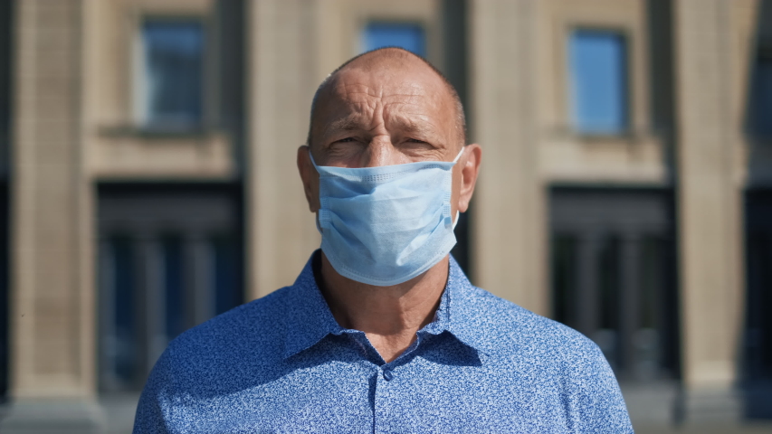 Old age People Looking at Camera. Respiratory white Mask Putting on. Older Senior Man Stand Portrait. Covid-19. Corona Virus Mers. Elder Aged Human. Coronavirus. Masked olderly Face put on. Covid 19. Royalty-Free Stock Footage #1055247035