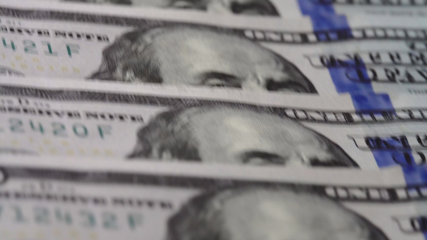 Macro many 100 american dollar bills. Cash money banknotes. Franklin's face texture. Finance and investment concept. Closeup shot. Currency exchange of one hundred usd. Rich business economy of usa | Shutterstock HD Video #1055254025