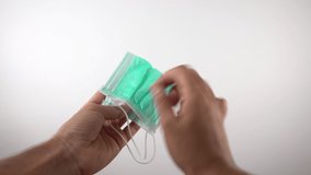 hands putting face mask on first person - Powered by Shutterstock - Get 15% off with code: PIKWIZARD15