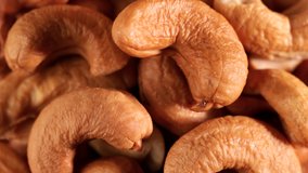 Video of cashews nut rotates slowly. Closeup shot in 4K resolution. Healthy food for dieting or snack.