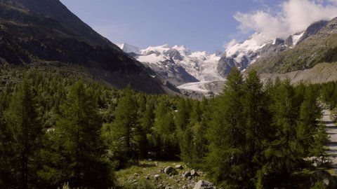 Drone aerial view of stunning mountain glacier views in Switzerland. Drone flying above pristine landscape in the Alps 