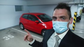 A manager in a mask on face sells car through video blog car. Social distance in car trade. Selling a car at a great distance. Communication in long distance.  - Powered by Shutterstock - Get 15% off with code: PIKWIZARD15
