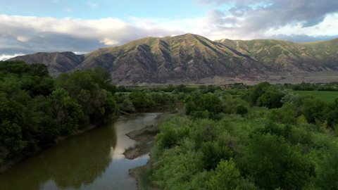 Beautiful 4K aerial footage above the Bear River in Box Elder County, Utah with the Wasatch Range in the background, no people