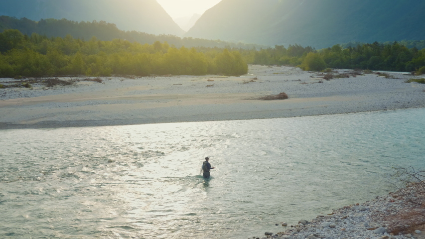 Fisherman enjoying fishing with a gorgeous landscape in the background