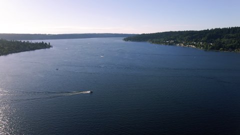 Drone Panning from Boat Up to Massive Body of Water