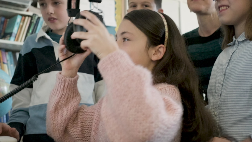 Children playing on a computer in classroom