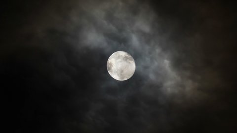 Full moon in the sky with clouds at night.
Video footage of full moon in the sky with clouds at night.