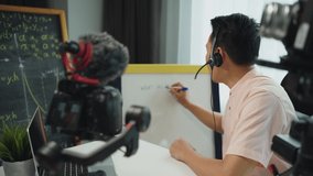 Online teachers are writing a whiteboard to communicate with students through video conferencing at home, Working remotely and social distancing 