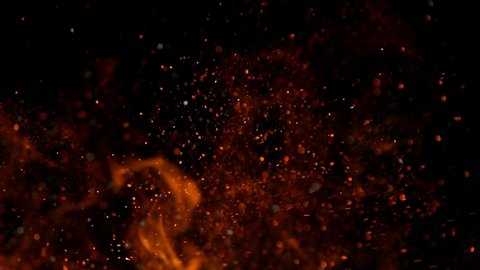 Super slow motion of fire sparks isolated on black background. Filmed on high speed cinema camera, 1000 fps