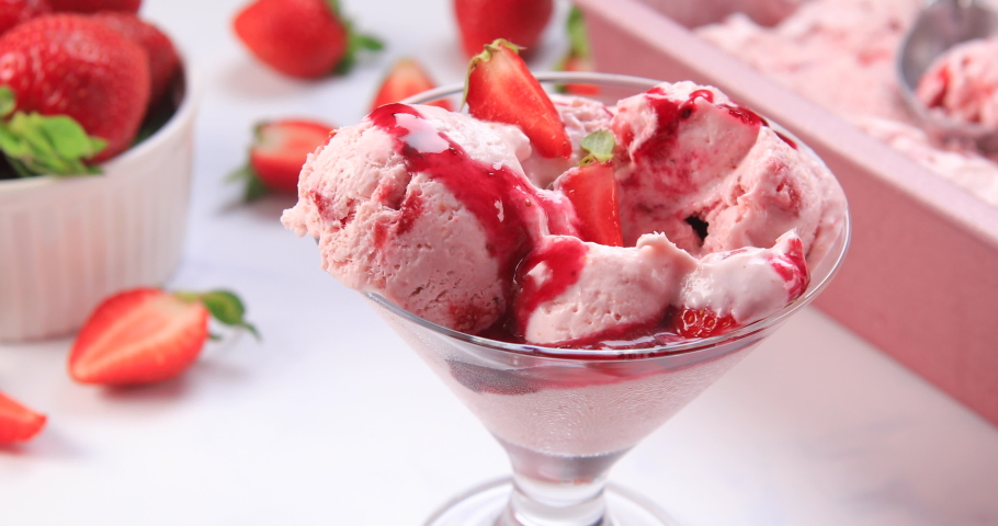 Scooped homemade strawberry ice cream ready to be served. Dolly shot 4k | Shutterstock HD Video #1055315429