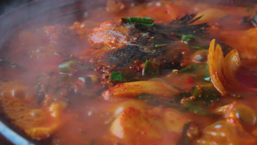 It is Korean food. It is a maeuntang cooked with fish, mushrooms, and vegetables that live in fresh water.