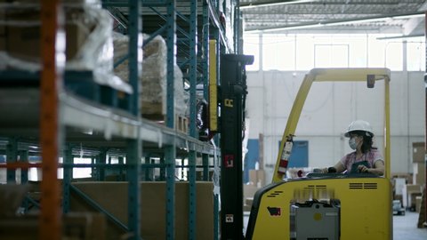 Forklift moving inventory’s  around for online delivery and shipping. Business is back to work. Shot in 4k. 