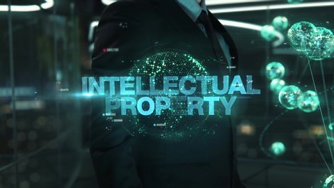 Businessman with Intellectual Property hologram concept
