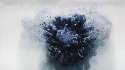 Ink water drop. Mysterious explosion. Steel blue glitter smoke puff flow on white abstract background.