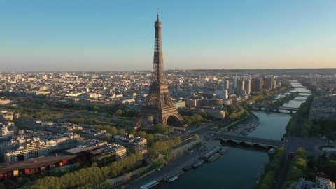 France, Paris Tour Eiffel (Eiffel tower), bridges and Trocadero, at sunset (or sunrise). 4k High Quality drone shot, aerial view above Seine river (looks like helicopter or drone shot).