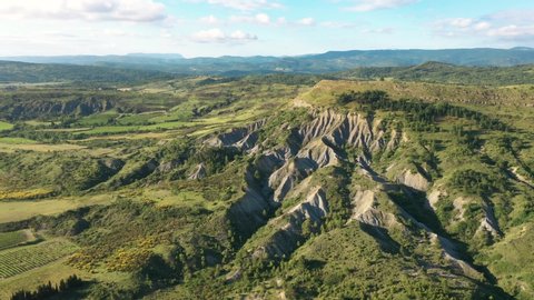 France, Massif des Corbières, flying above cliff crevices in french countryside, drone aerial shot