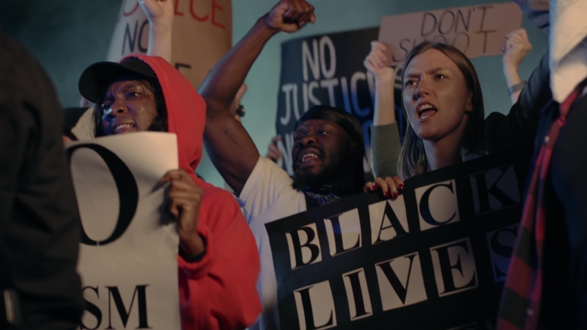 Diverse Shouting Young People Protesting the Brutal Police on Public Demonstration Riot for Human Rights Equality. Black Lives Matter. Stop Racism. Politics. News. Royalty-Free Stock Footage #1055365022