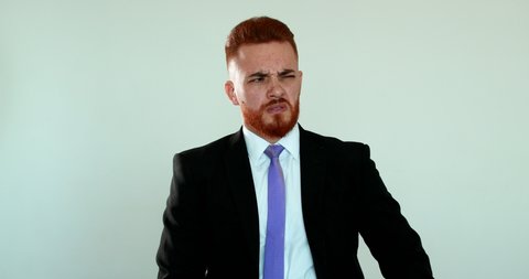 Business man feeling nauseated, redhead person nausea reaction