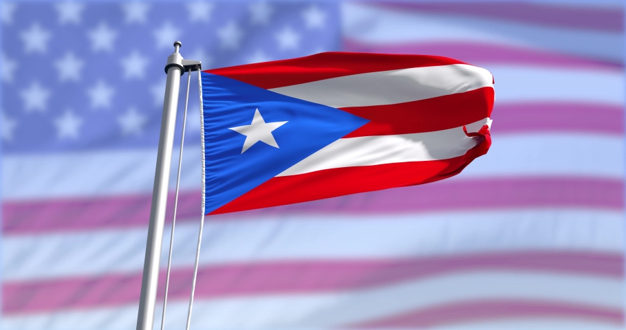 Puerto Rico flag on a flagpole on USA flag background waving in the wind in the sky. Wonderful intro for yor projects. The Commonwealth of Puerto Rico. in The United States of America. Royalty-Free Stock Footage #1055373725
