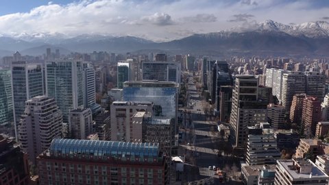 Aerial view of eastern Santiago of Chile. Modern buildings with the Andes mountain range in the background
