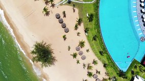 High quality royalty free stock footage, Aerial view of tropical sandy beach with palms and calm sea . Shot in Vietnam ,Phu Quoc, Romantic beach from the top video concept with beach resorts