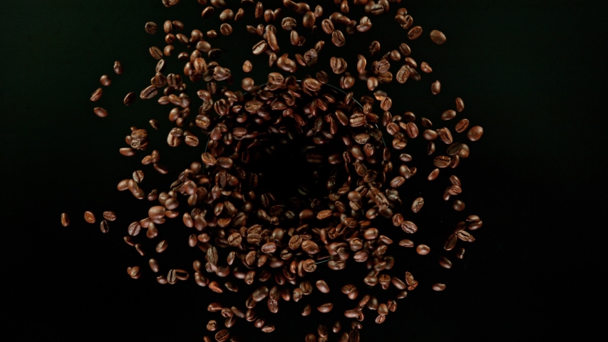 Coffee beans explosion, super slow motion, top view. | Shutterstock HD Video #1055391986
