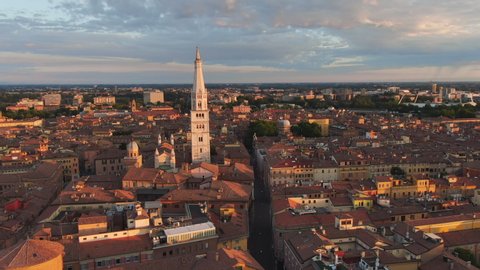 modena city center aerial shot drone flying to cathedral duomo at dawn